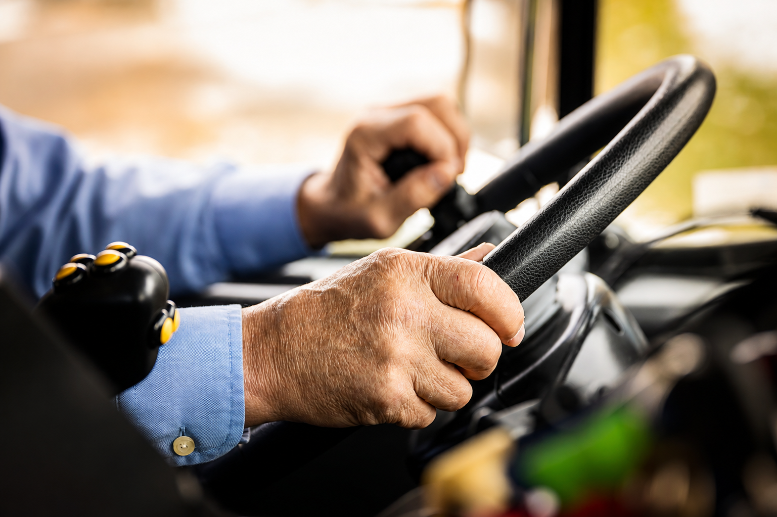 Driver operating a collection truck